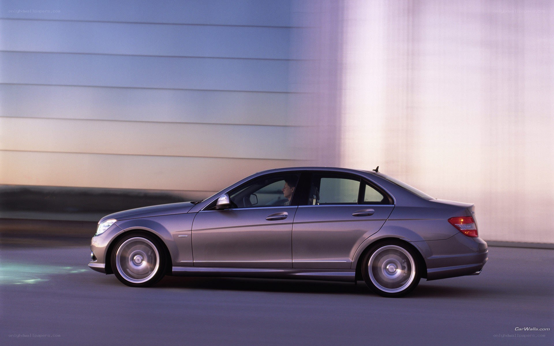 silver sedan in motion
