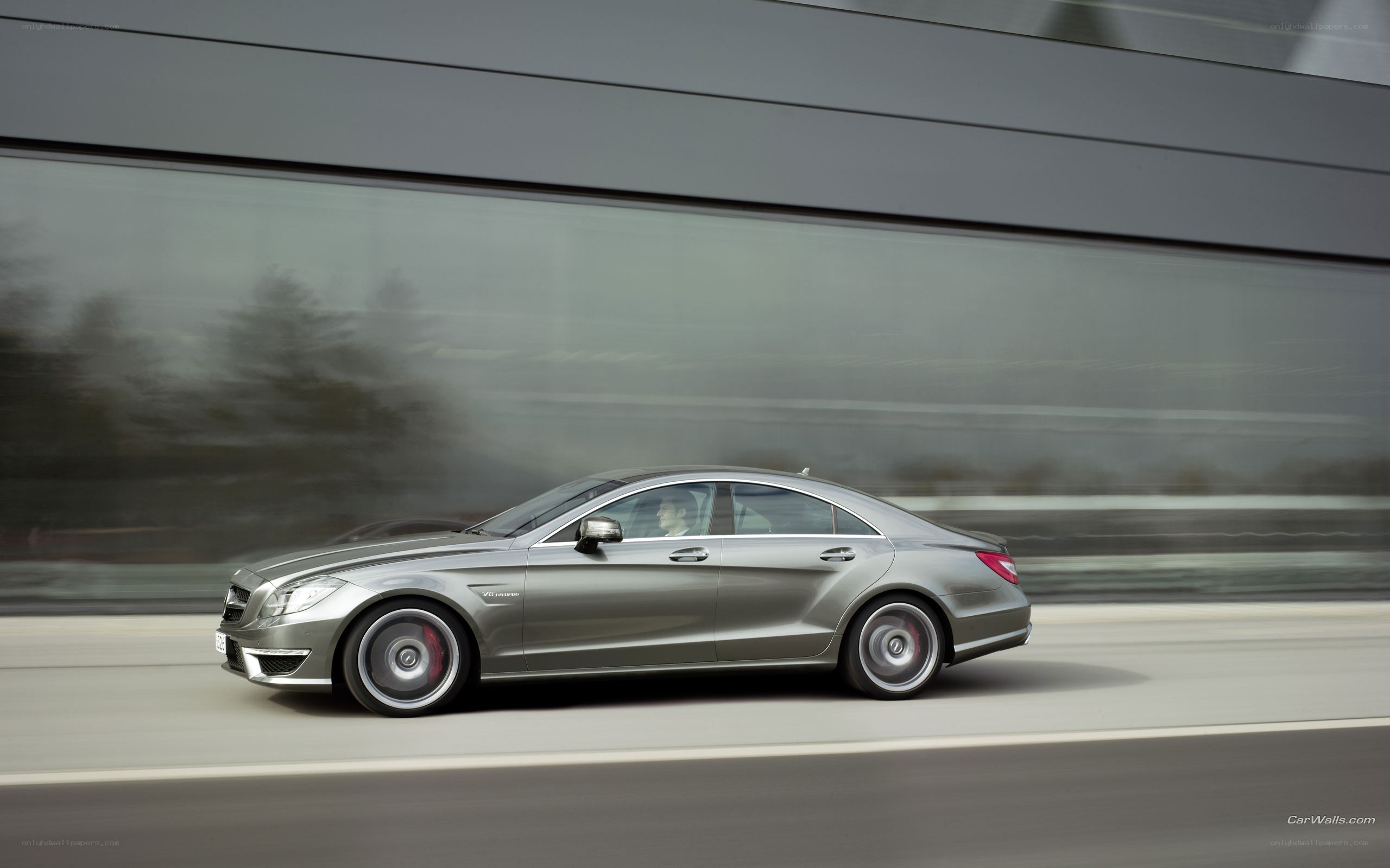 silver sedan in motion