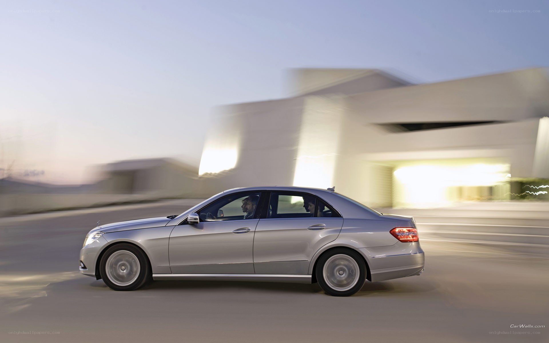 silver sedan in motion