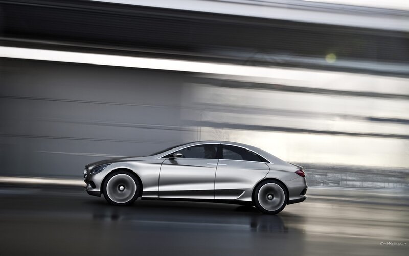 silver sedan in motion