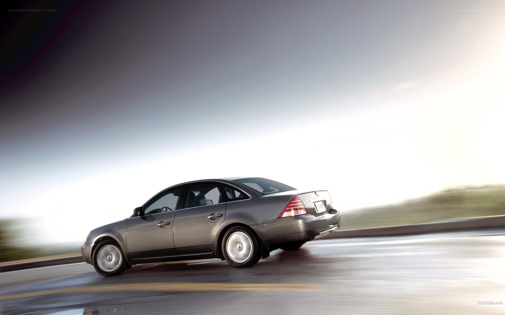 silver sedan in motion