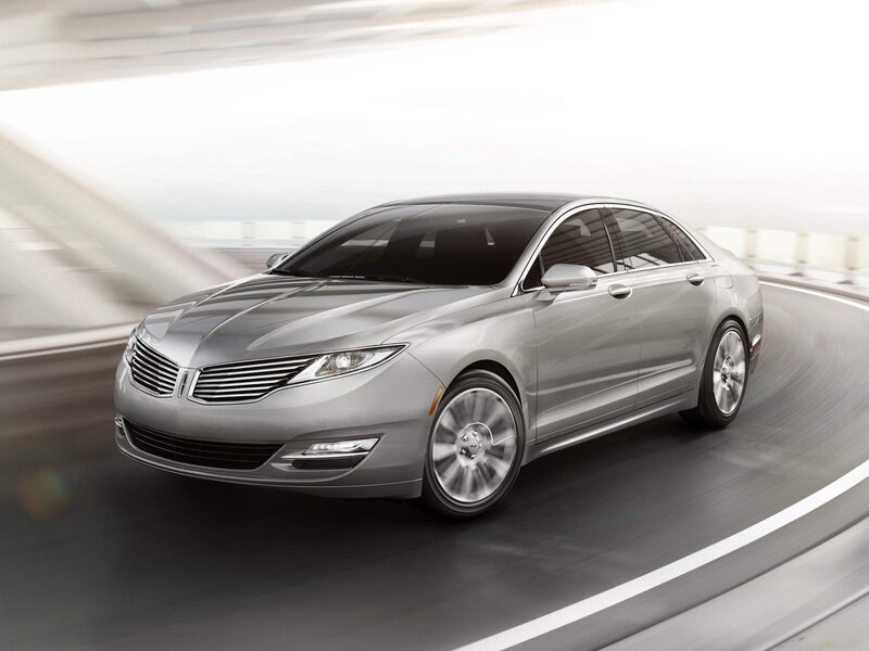 silver sedan in motion