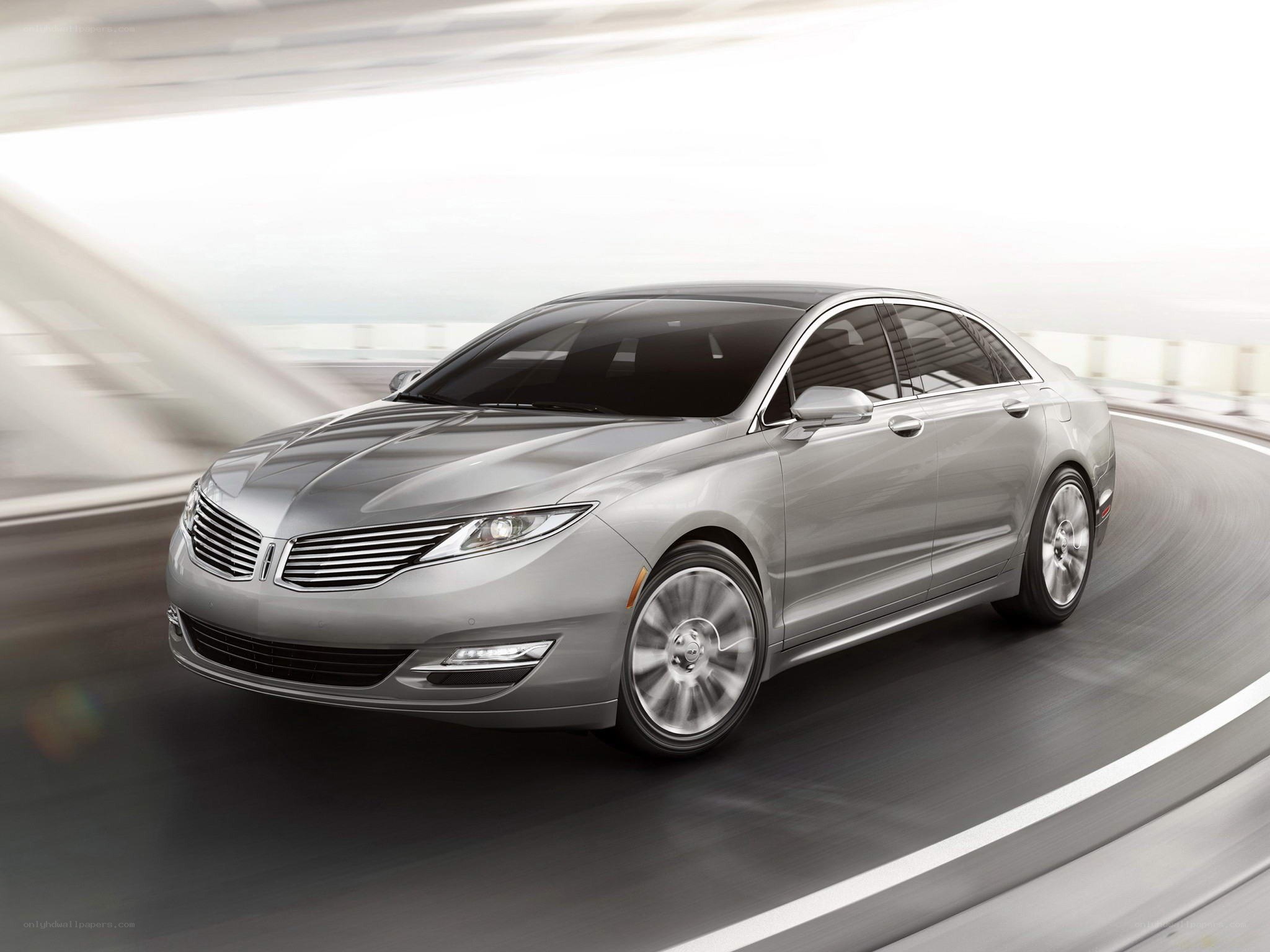 silver sedan in motion