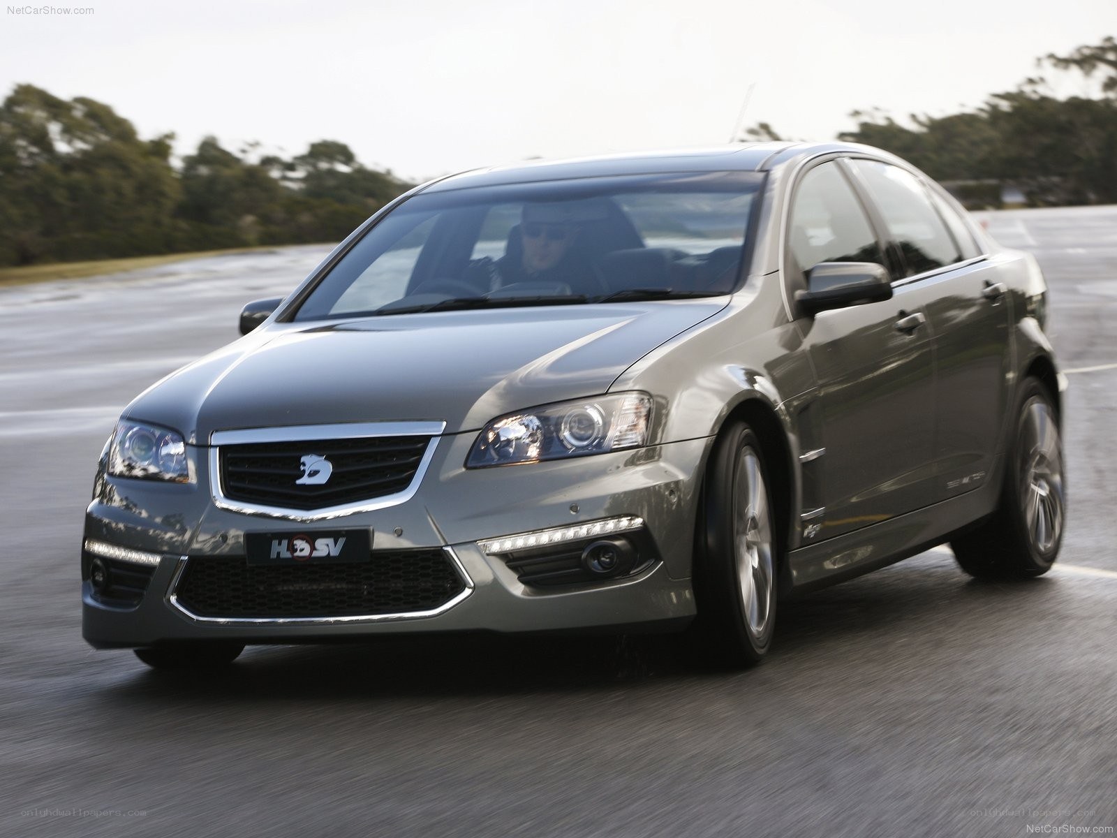 silver sedan in motion