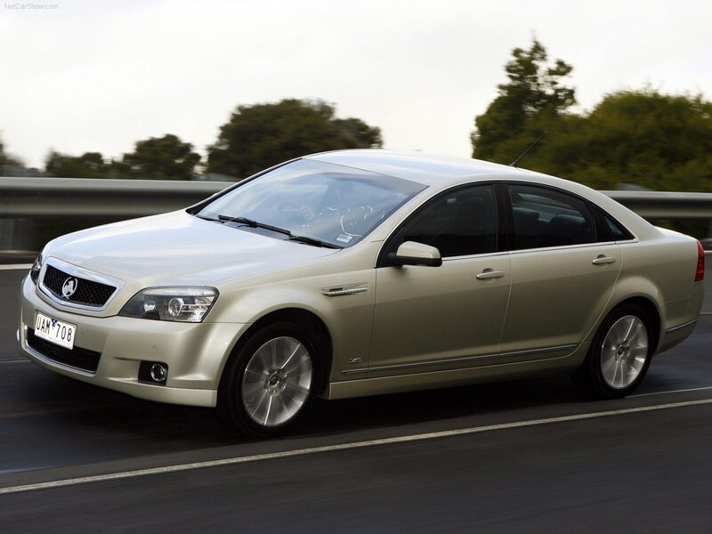 silver sedan in motion