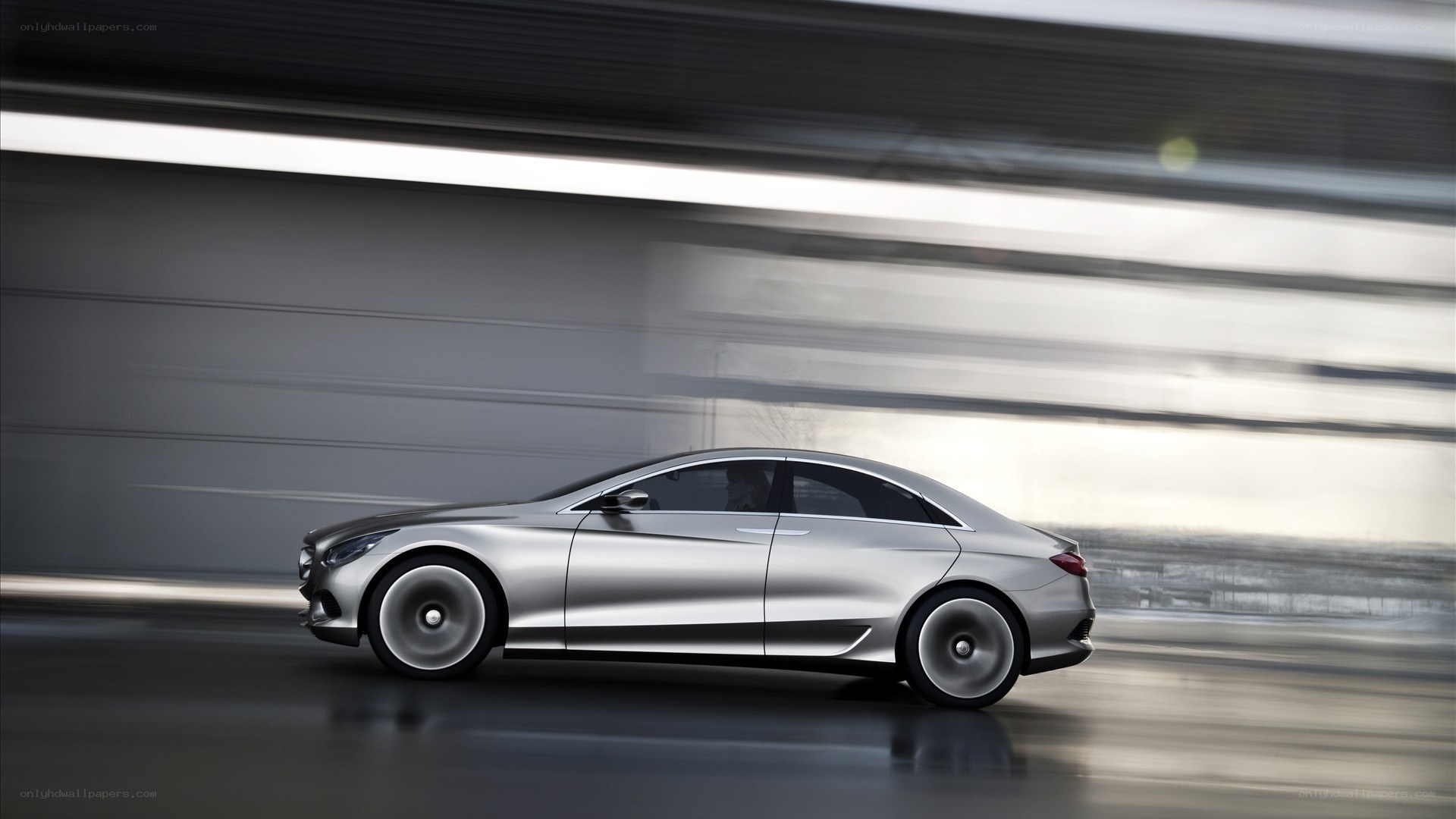 silver sedan in motion