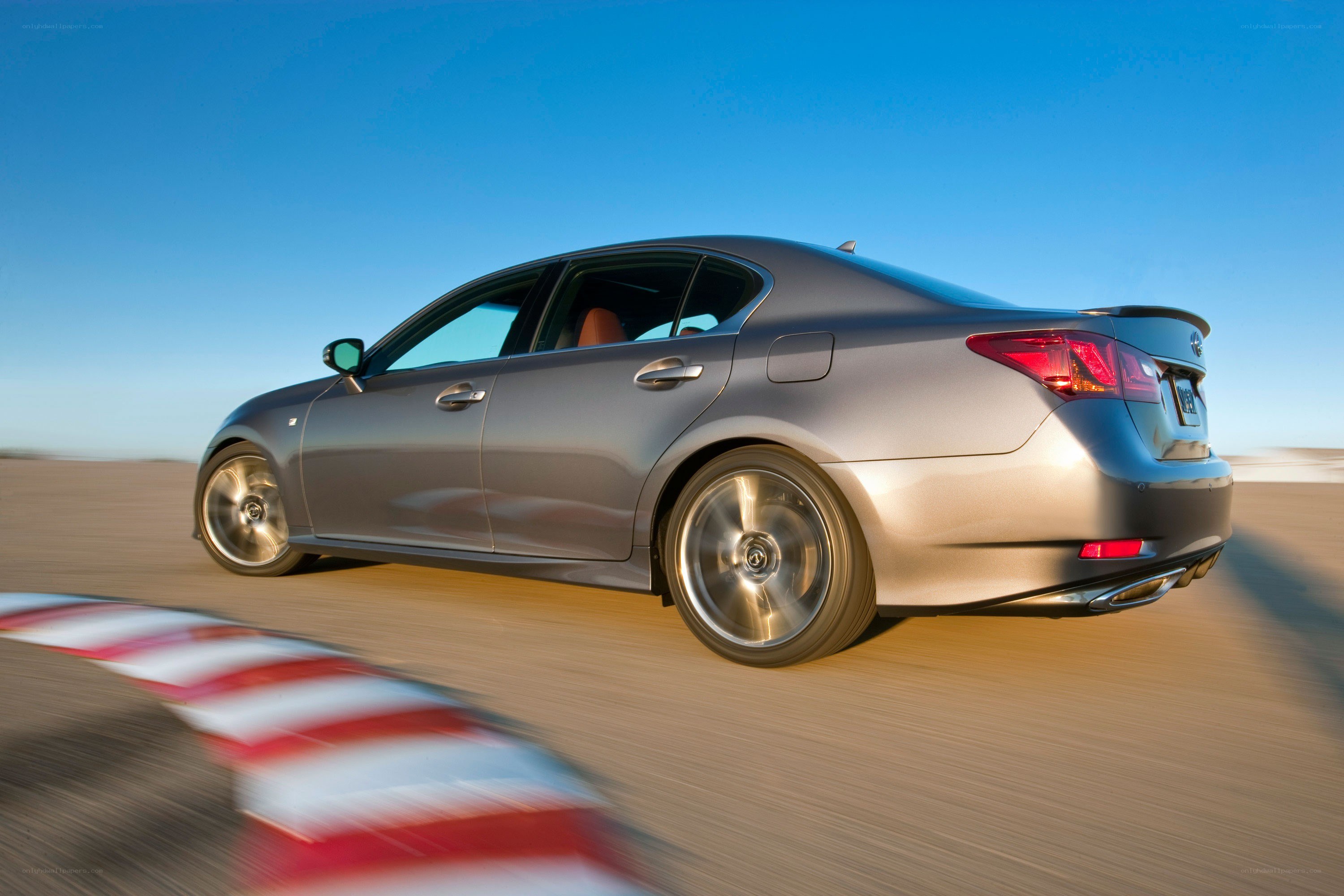silver sedan in motion