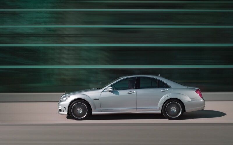 silver sedan in motion