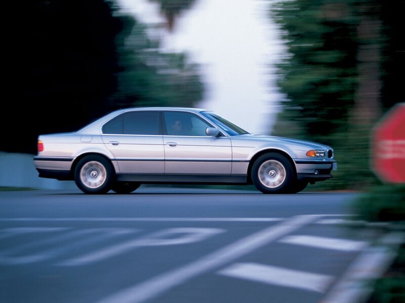 silver sedan in motion