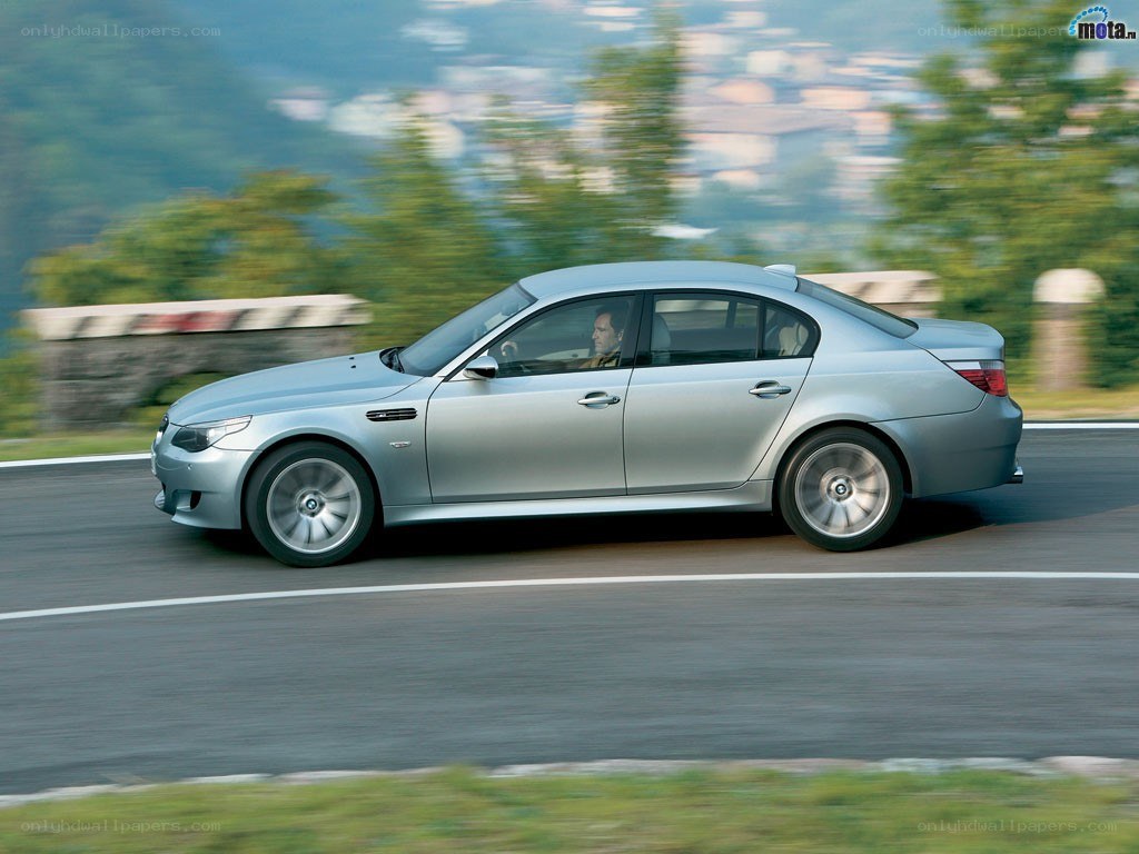 silver sedan in motion