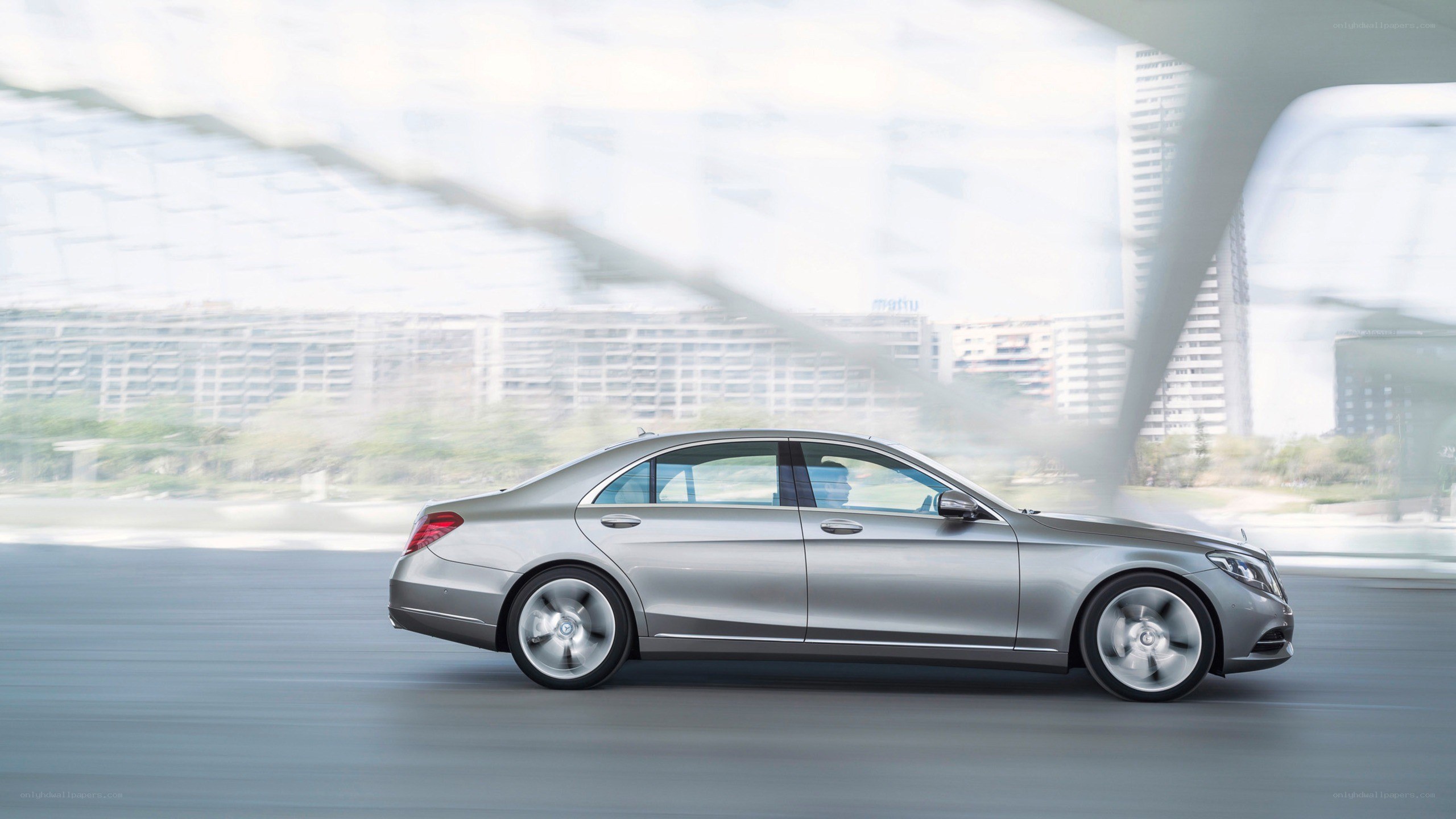 silver sedan in motion