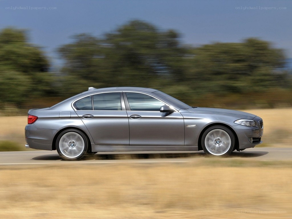 silver sedan in motion