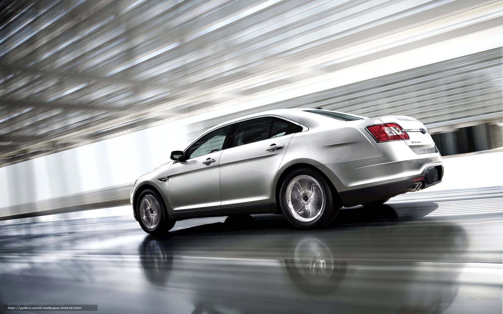 silver sedan in motion