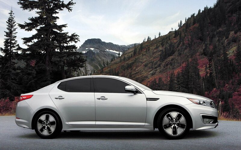 Silver sedan in mountain landscape