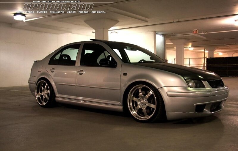 silver sedan in parking garage