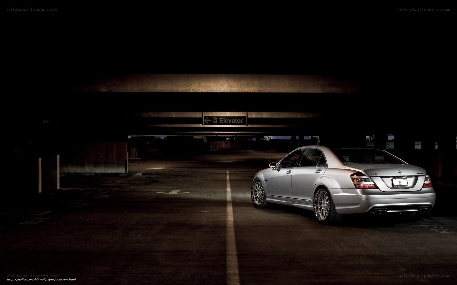 Silver sedan in parking garage