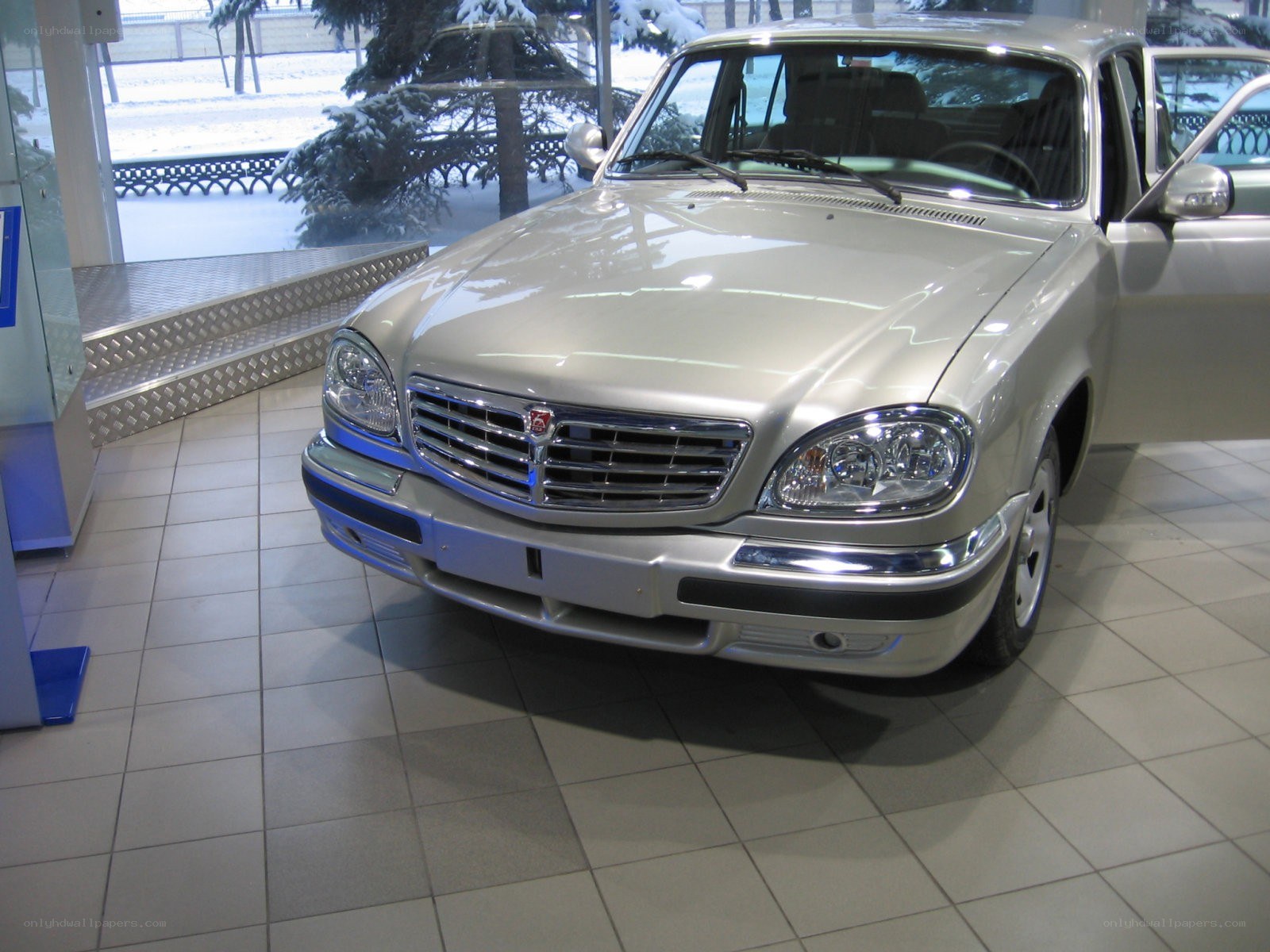 silver sedan in showroom