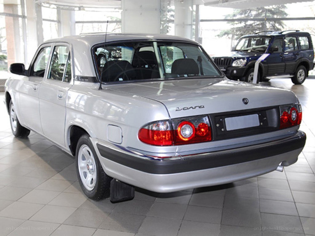 silver sedan in showroom
