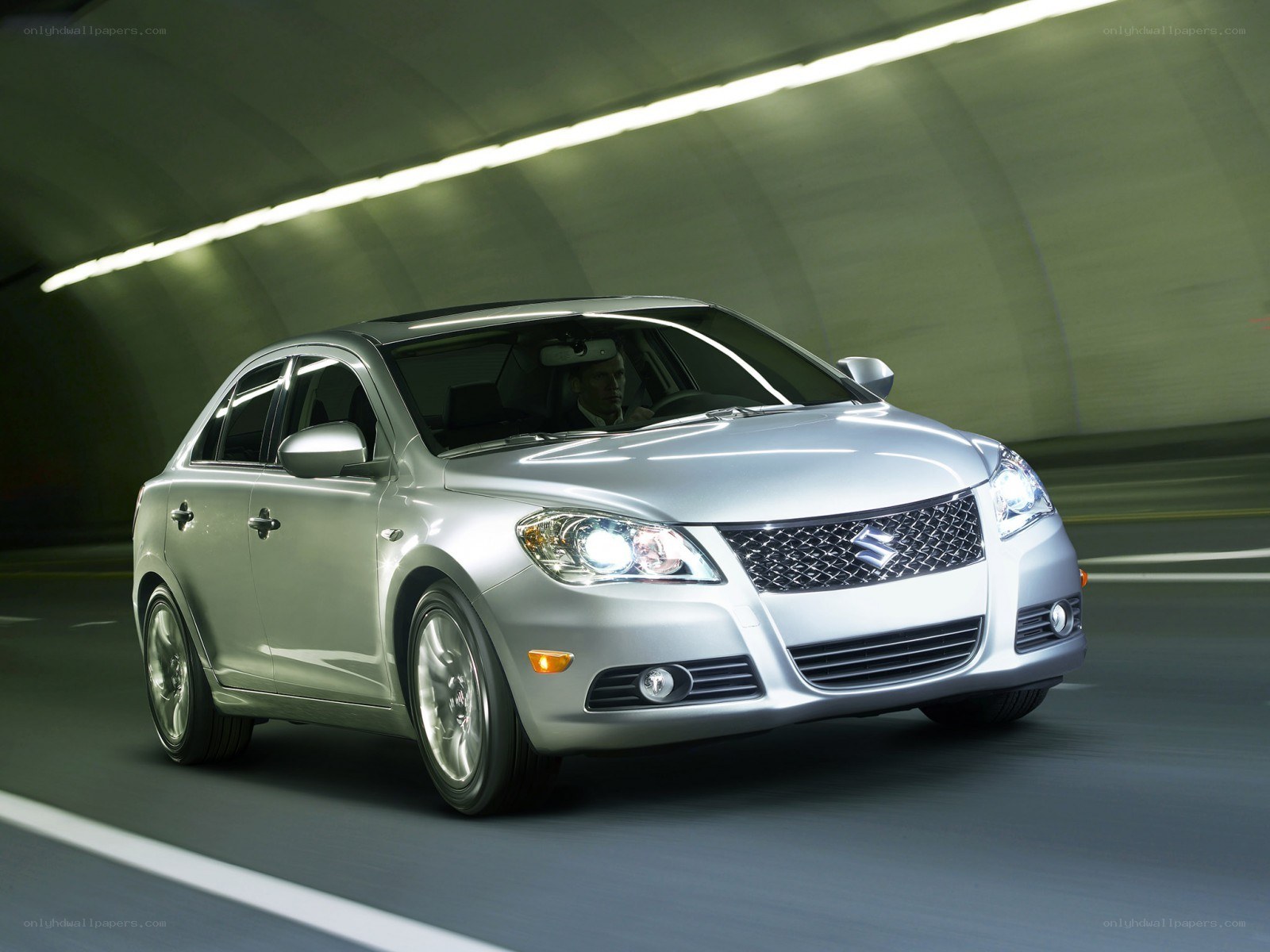 Silver sedan in tunnel