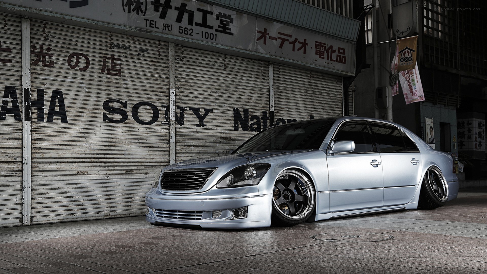 silver sedan in urban setting