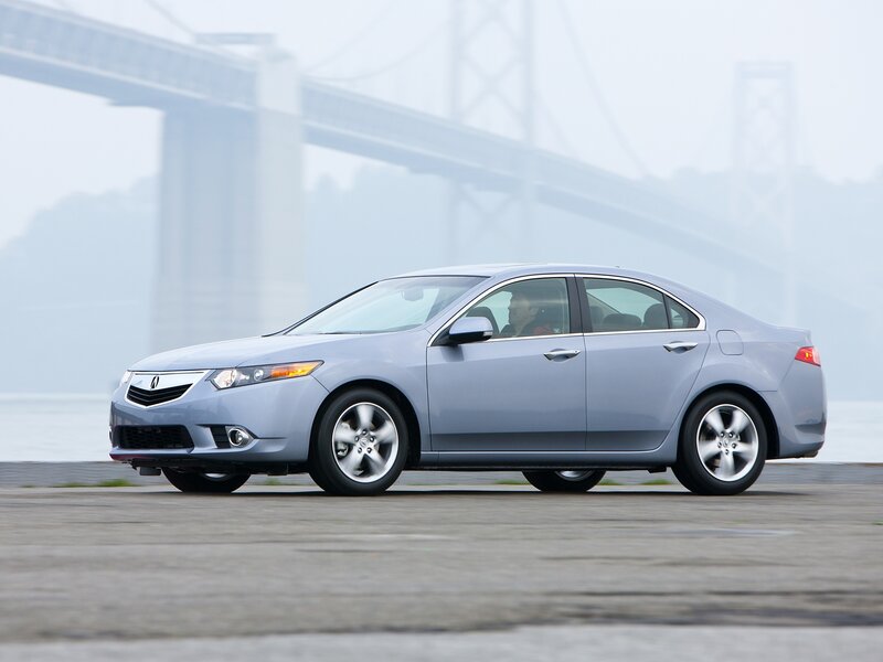 silver sedan on a bridge