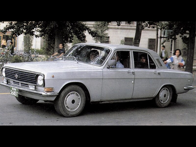 Silver sedan on a city street