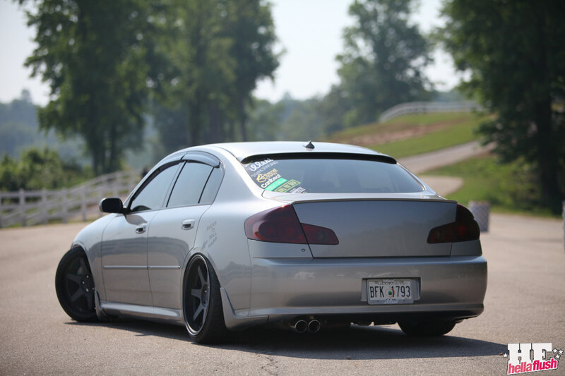 silver sedan on a country road