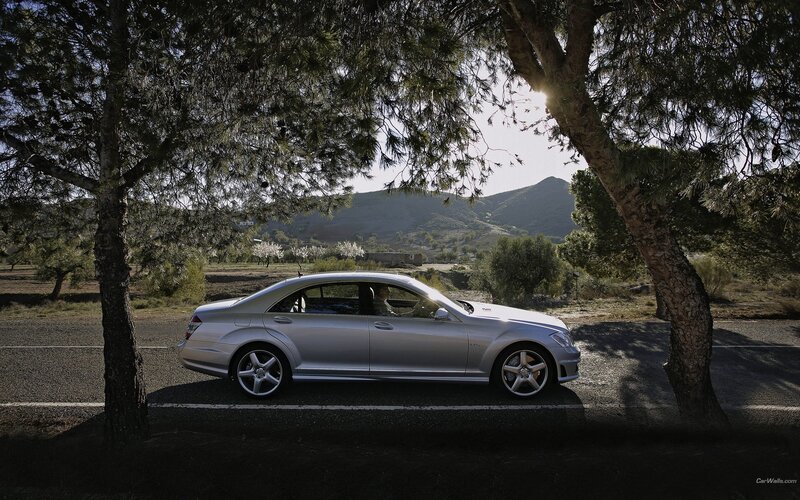 Silver sedan on a country road