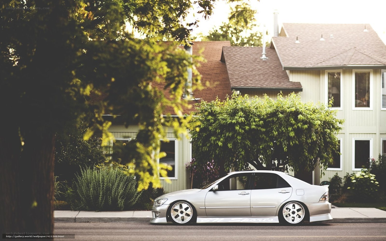 silver sedan on a quiet street
