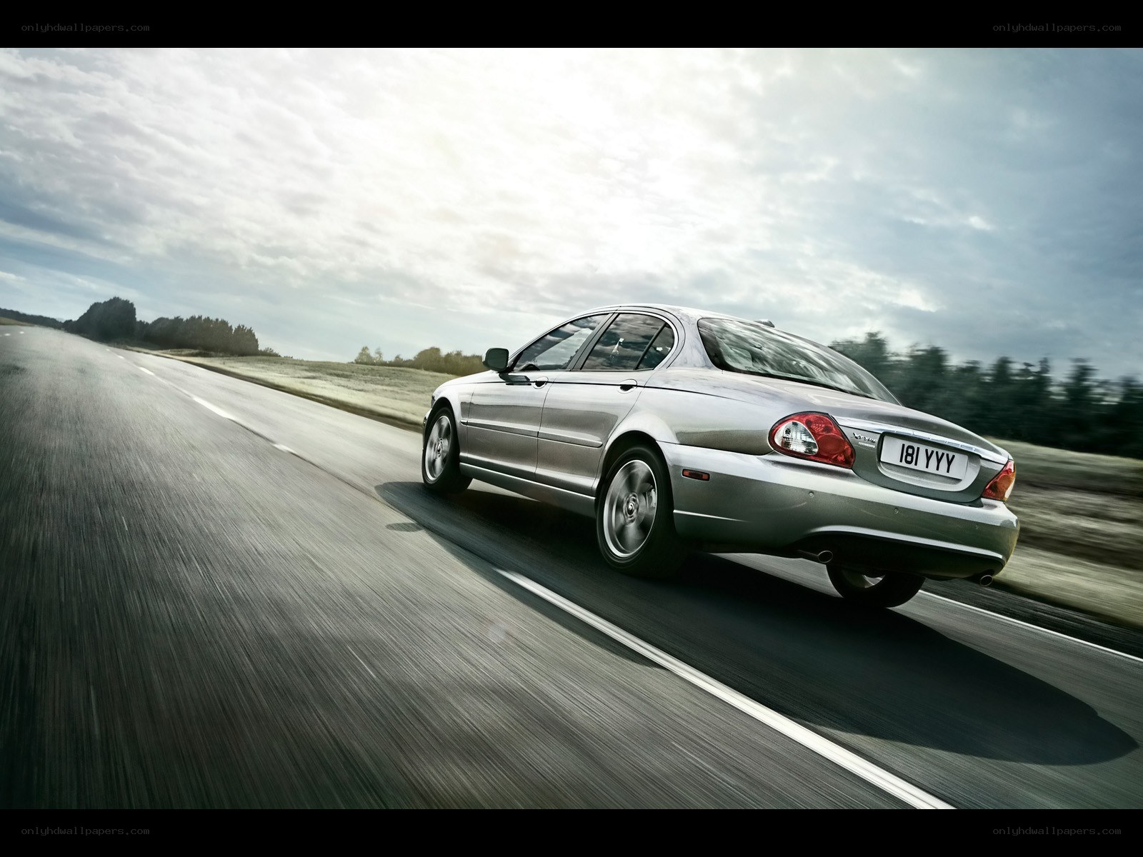 silver sedan on a road