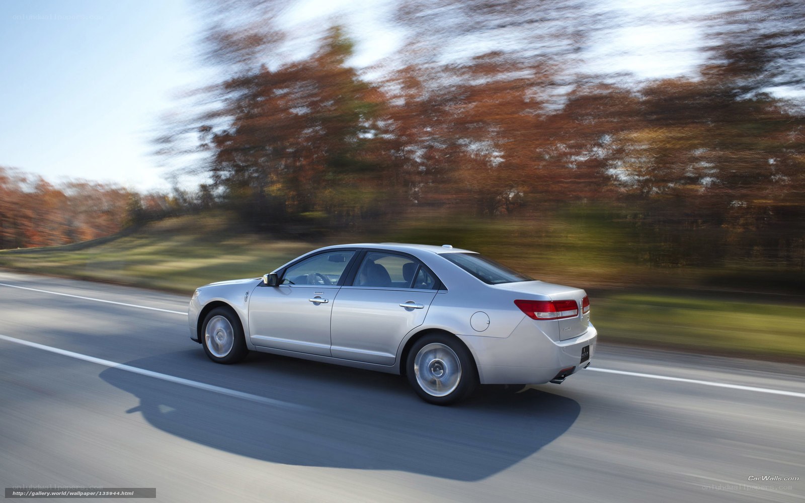 silver sedan on a road