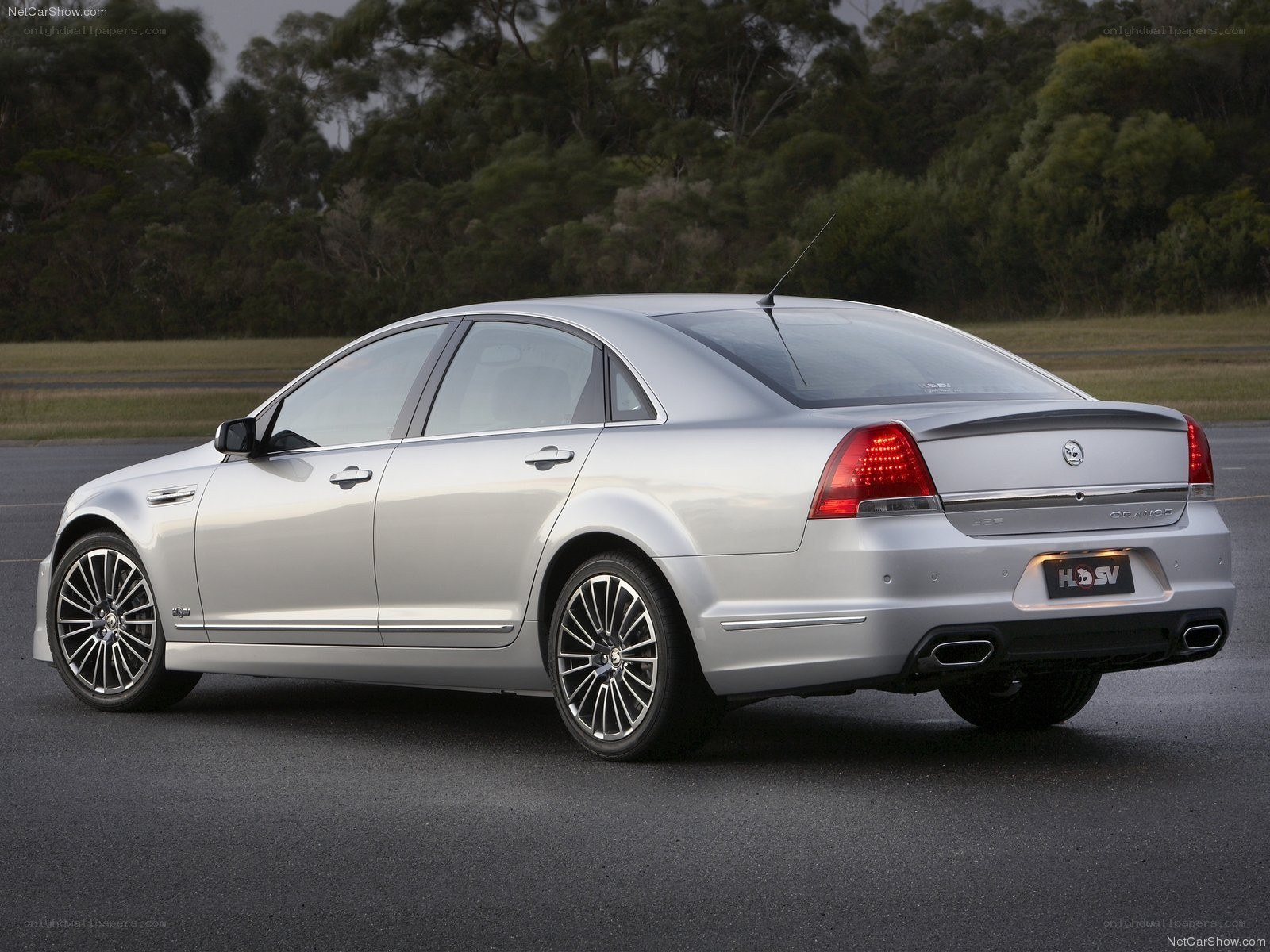 silver sedan on asphalt