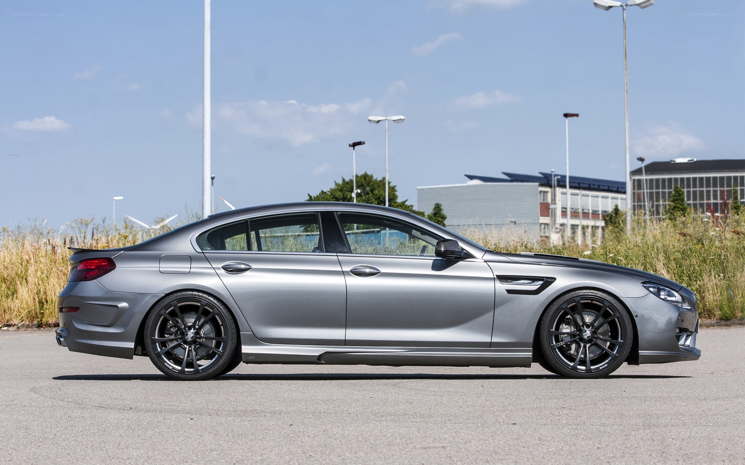 silver sedan on asphalt