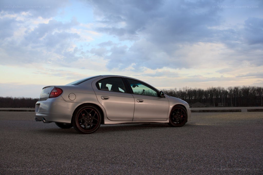 silver sedan on asphalt