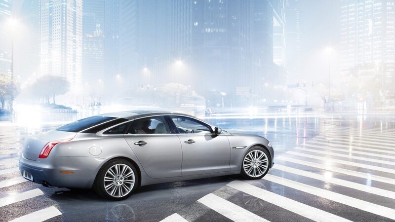 silver sedan on city street