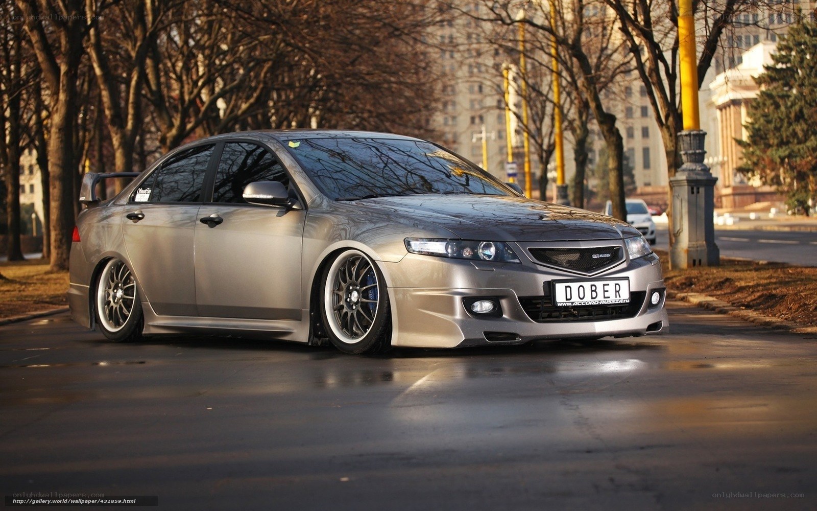 silver sedan on city street
