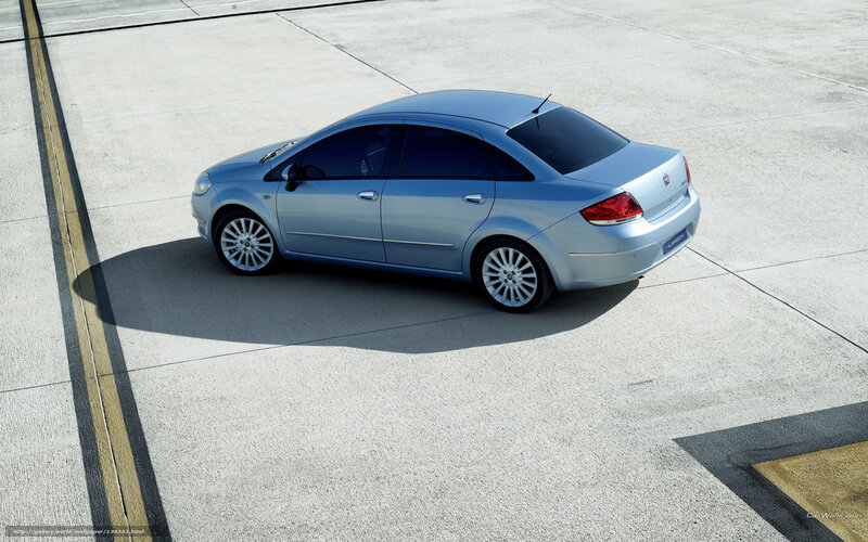 silver sedan on concrete