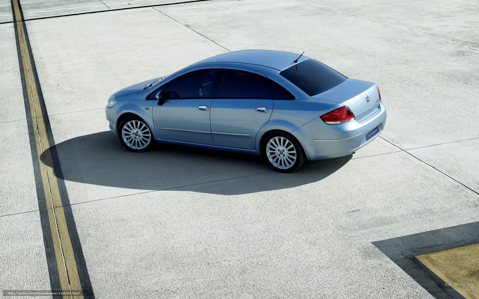 silver sedan on concrete