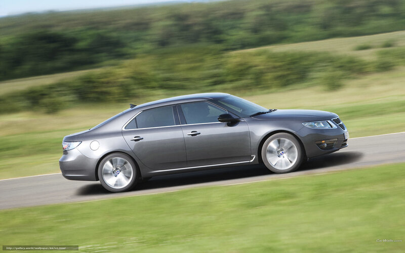 silver sedan on country road