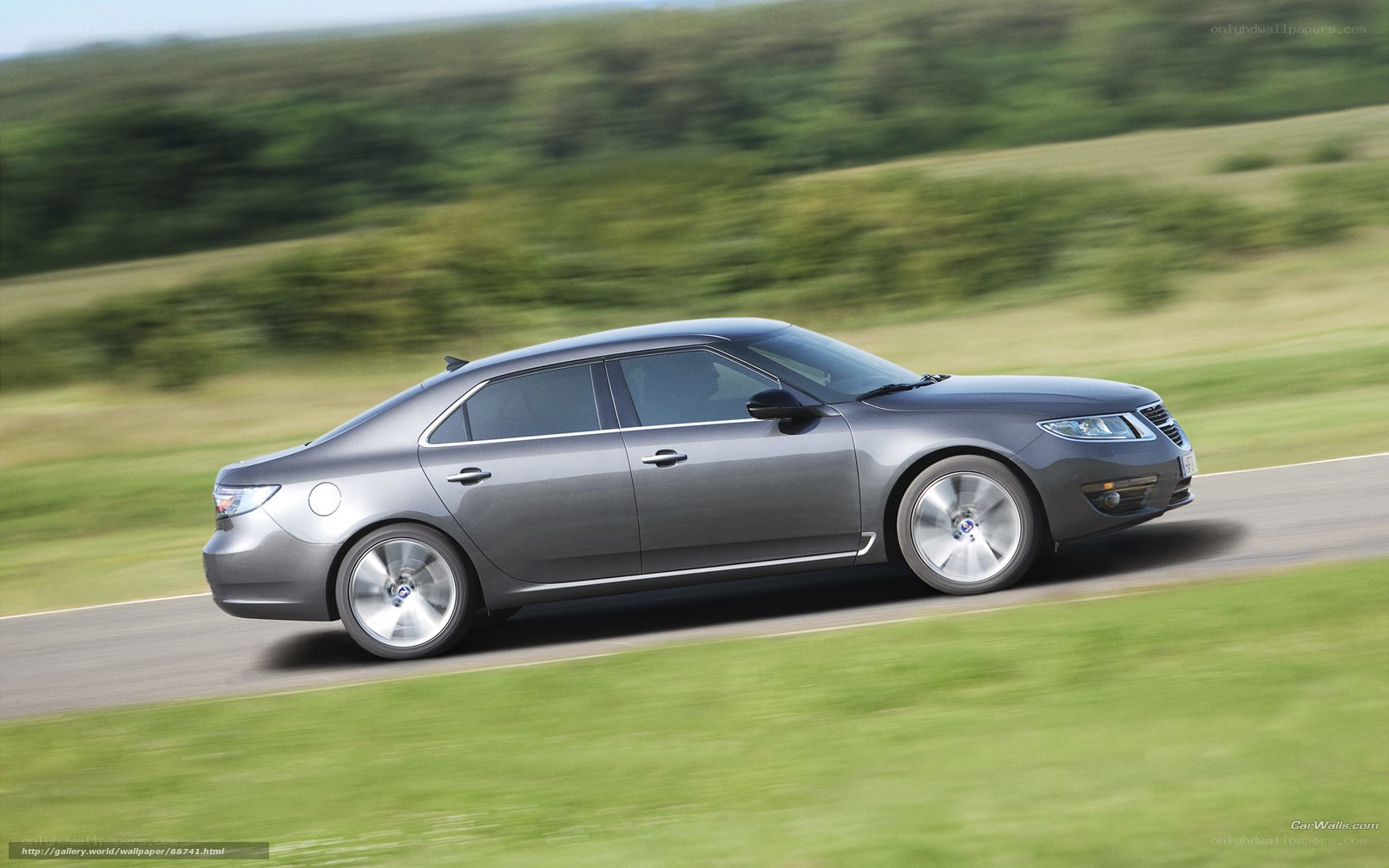 silver sedan on country road