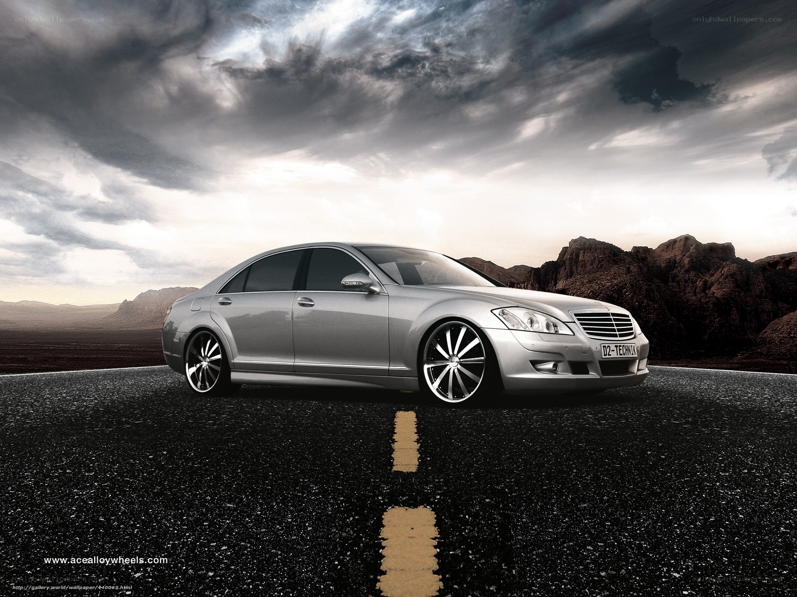 Silver sedan on desert road