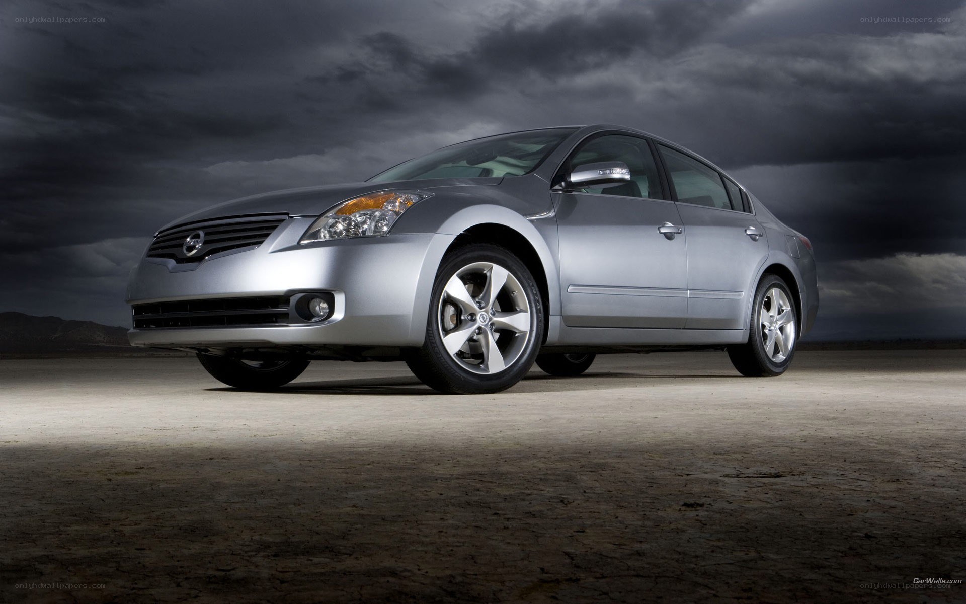 silver sedan on desert road