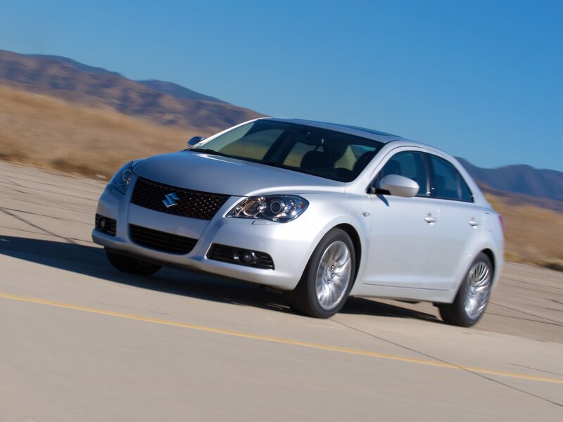 silver sedan on desert road