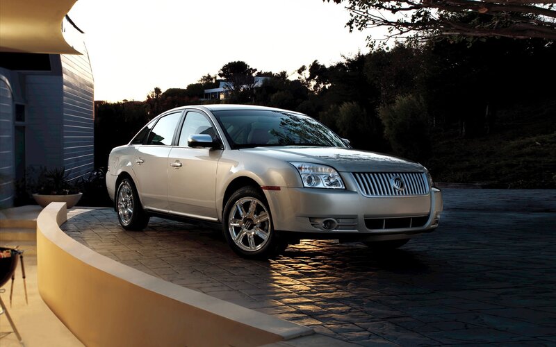 silver sedan on driveway