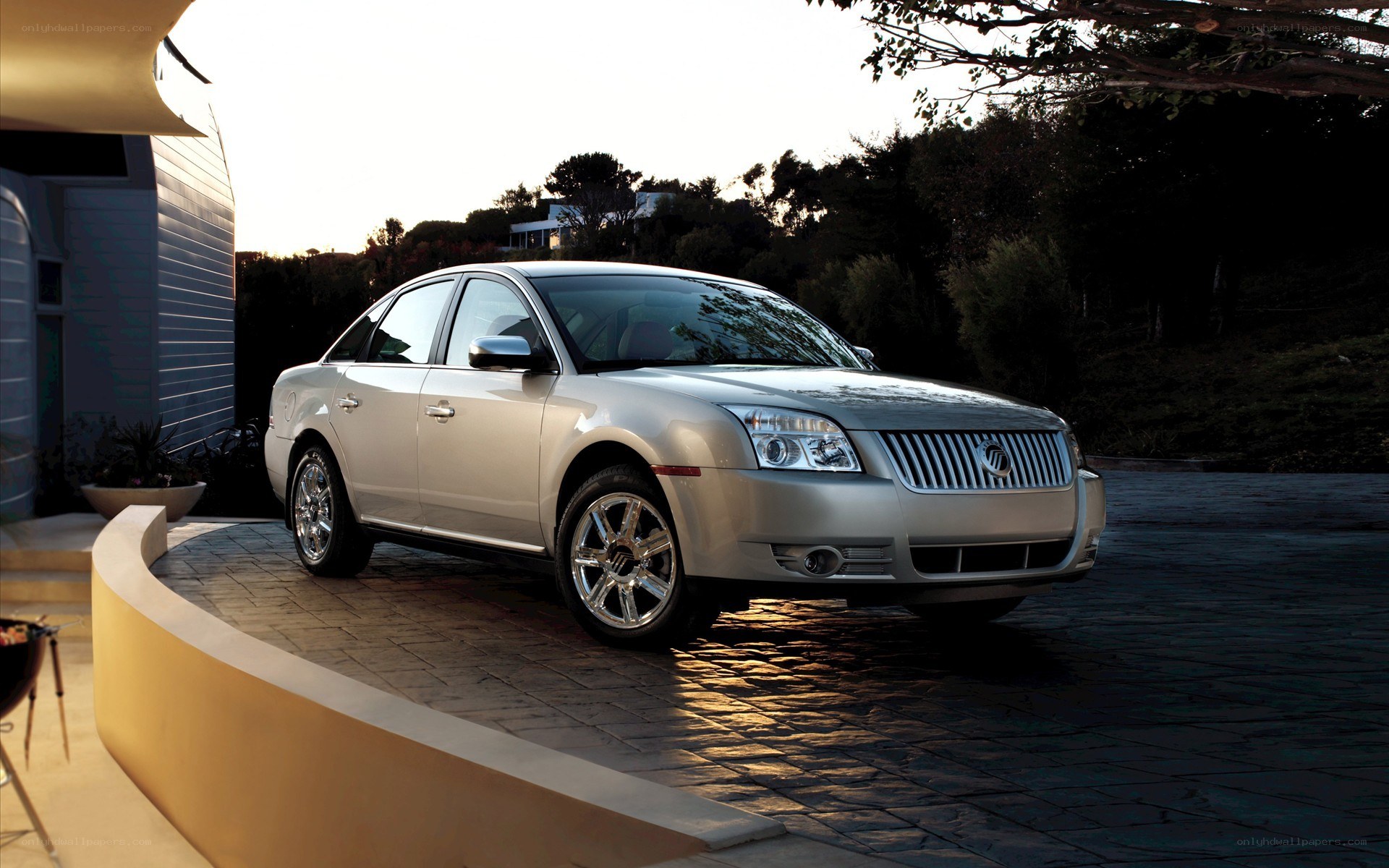 silver sedan on driveway