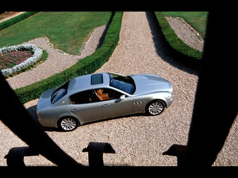 Silver sedan on gravel driveway