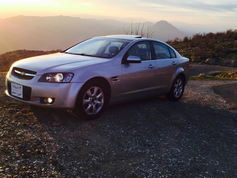 Silver Sedan on Gravel — Gray
