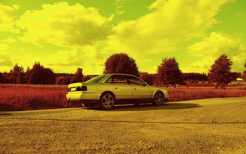 Silver Sedan on Gravel — Yellow