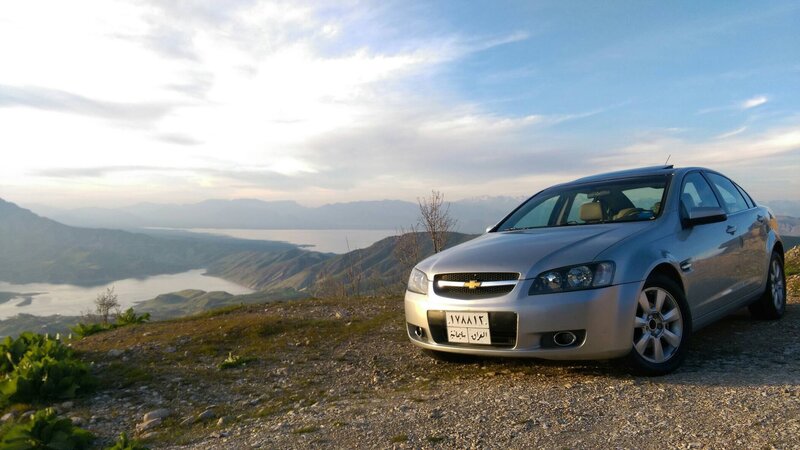 Silver Sedan on Hillside — Gray
