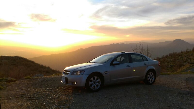 Silver Sedan on Hillside